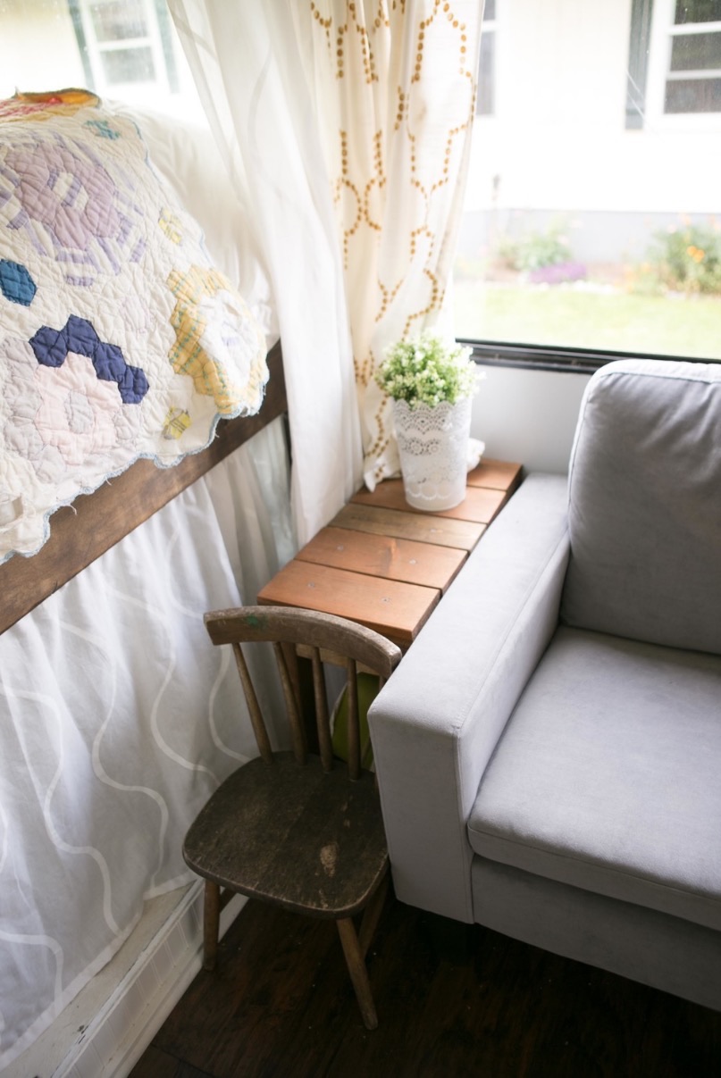 Detail of kitchen storage and pantry organization inside the converted motorhome