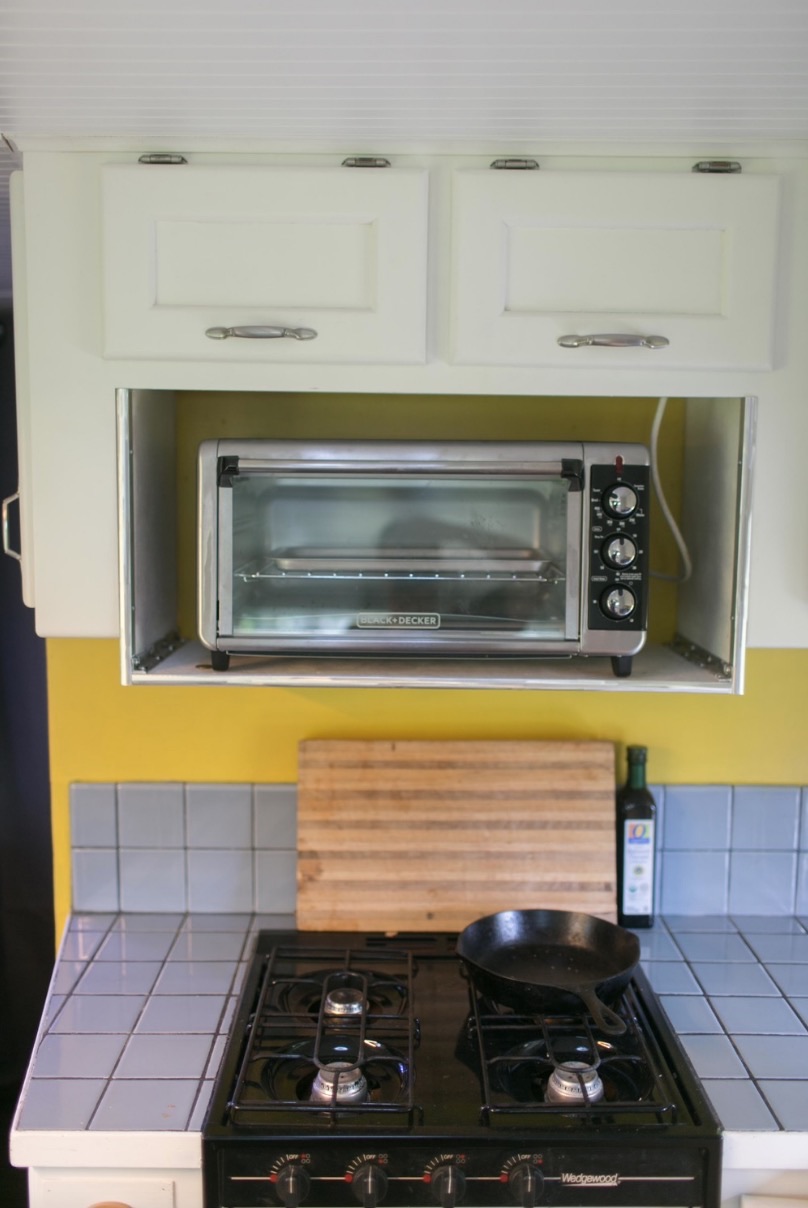Bathroom fixtures and storage solutions inside the converted Safari motorhome