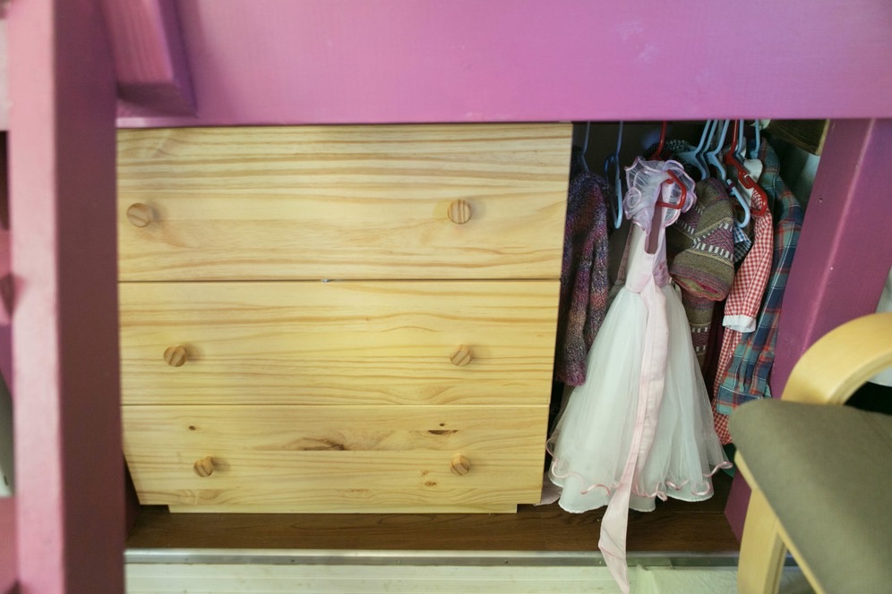 Family photos and children's artwork displayed throughout the motorhome