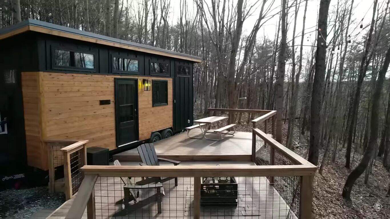 Tiny House with Deck in Forest Setting