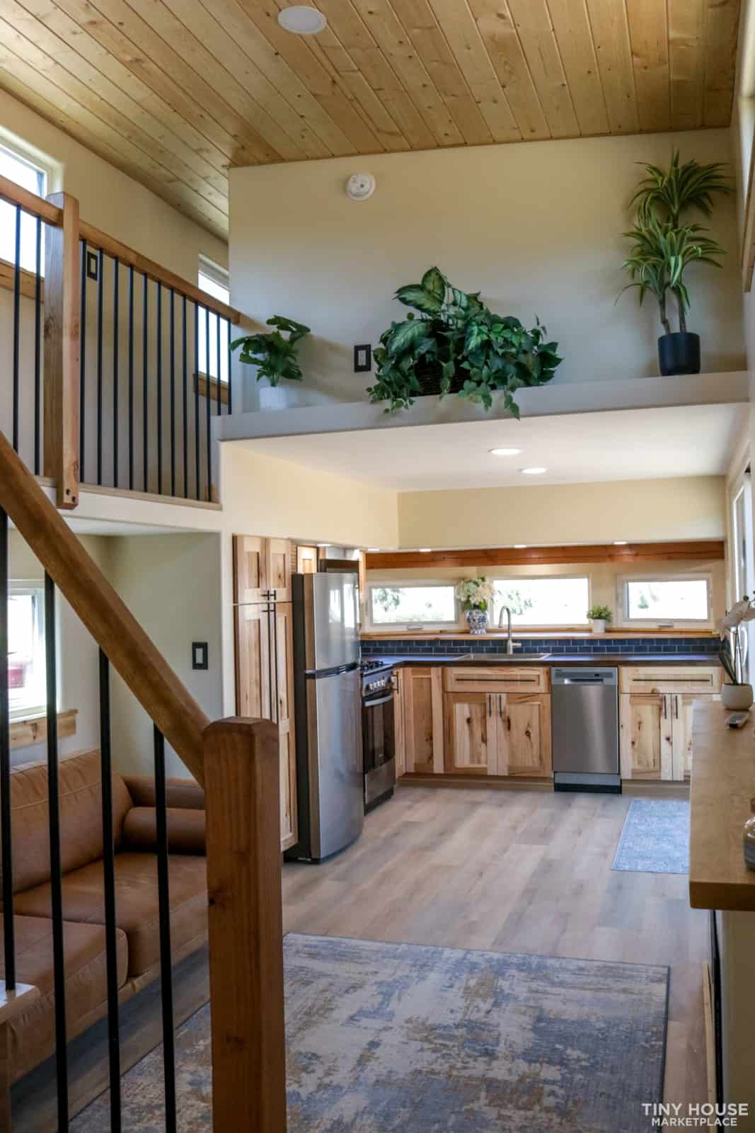 View from the staircase across the living room to the open kitchen
