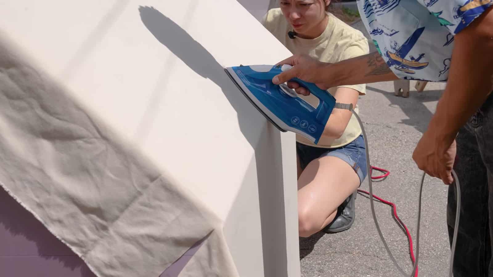 Ironing canvas over the outside corner of the assembled foam shell