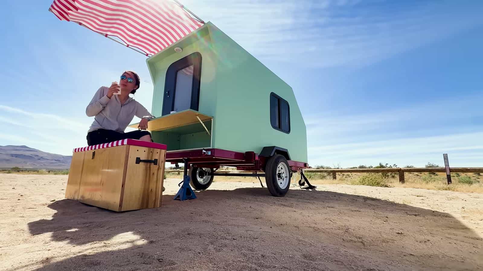 Camping at the fold-down counter of the foamie teardrop in the desert