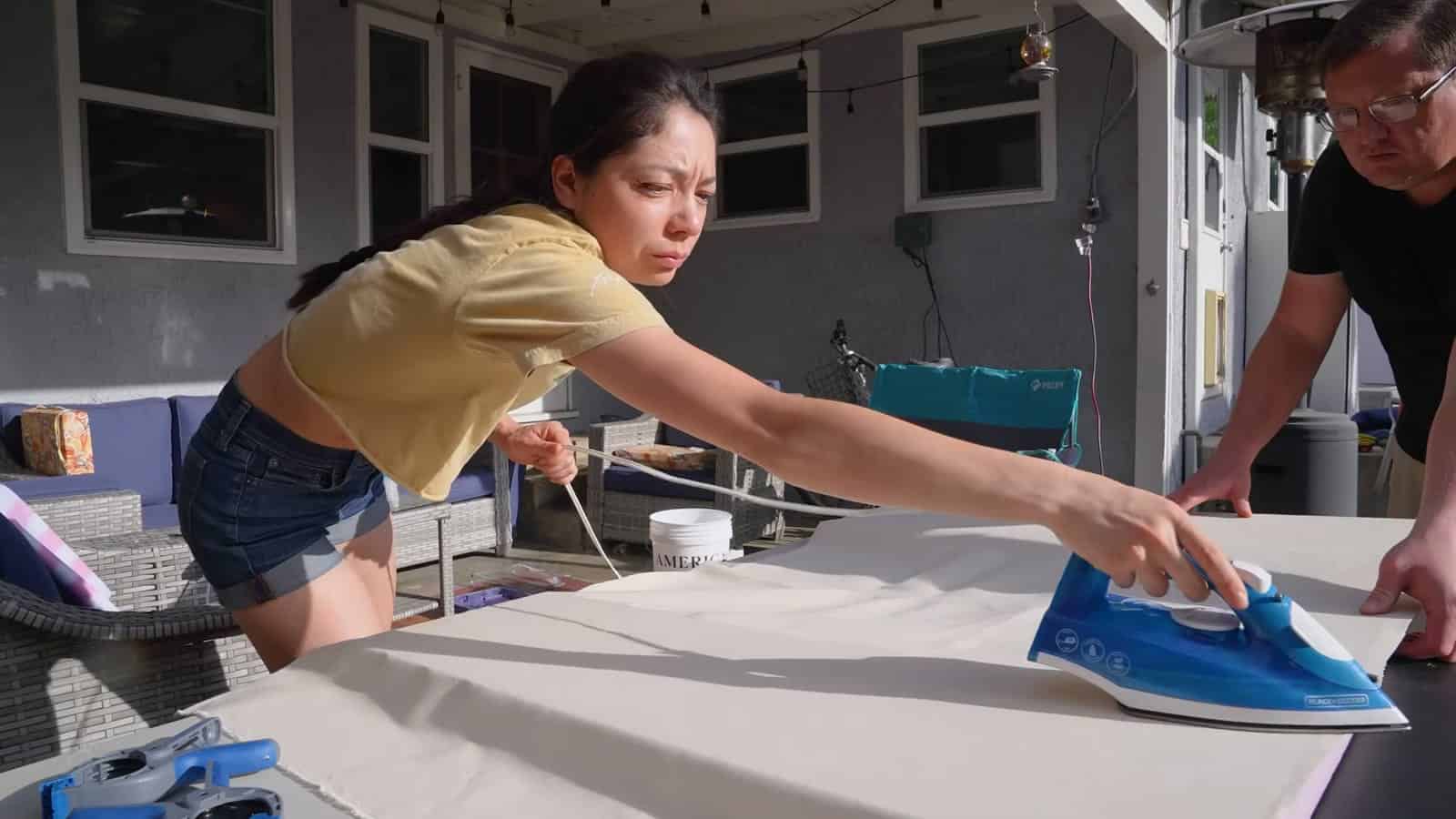 Ironing canvas smooth onto glued foam panels for poor man's fiberglass