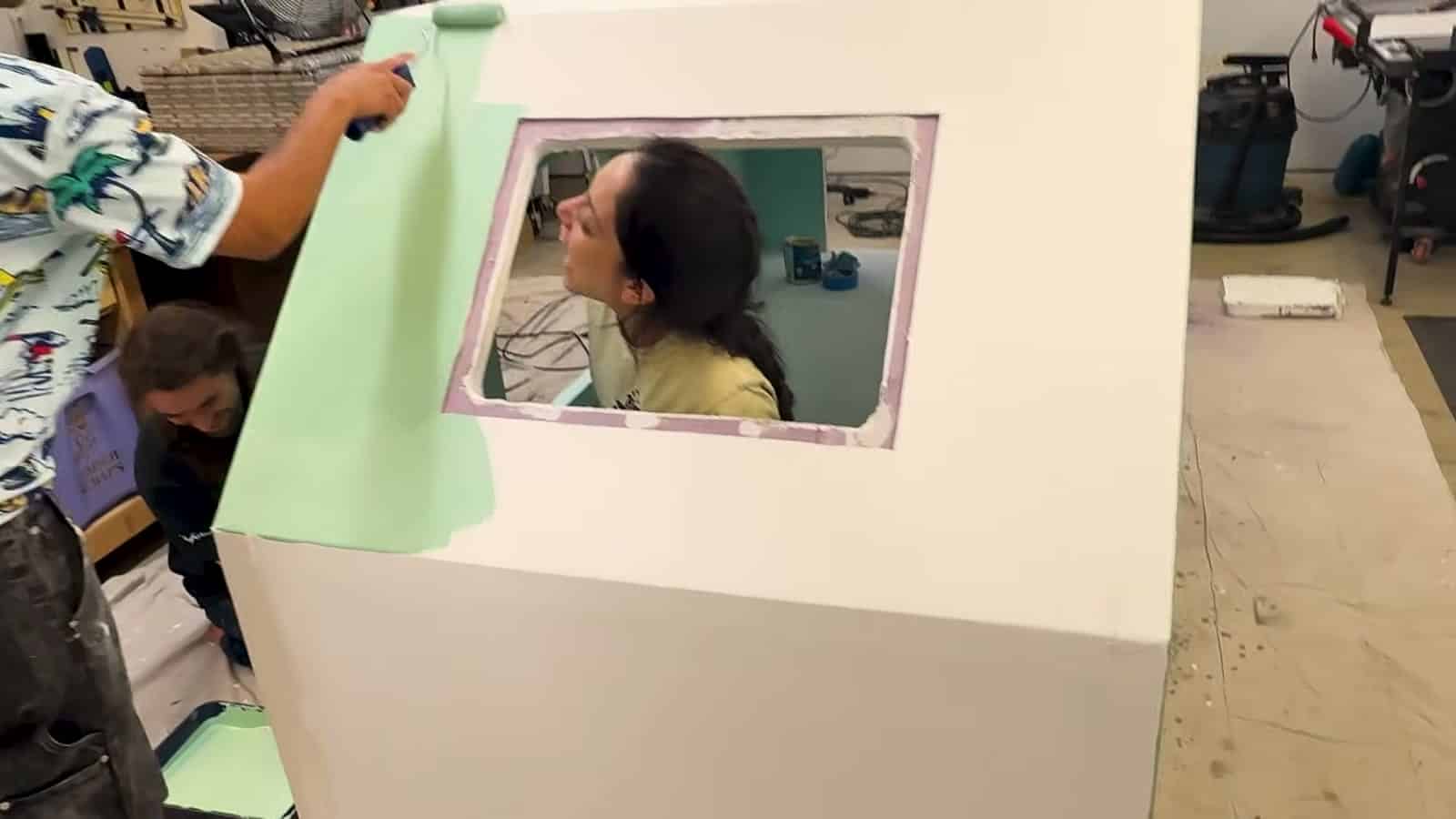 Window cutout in the painted mint green foam camper wall