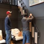 Folding stairs installed in a tiny house for efficient space use and easy access to the upper level.