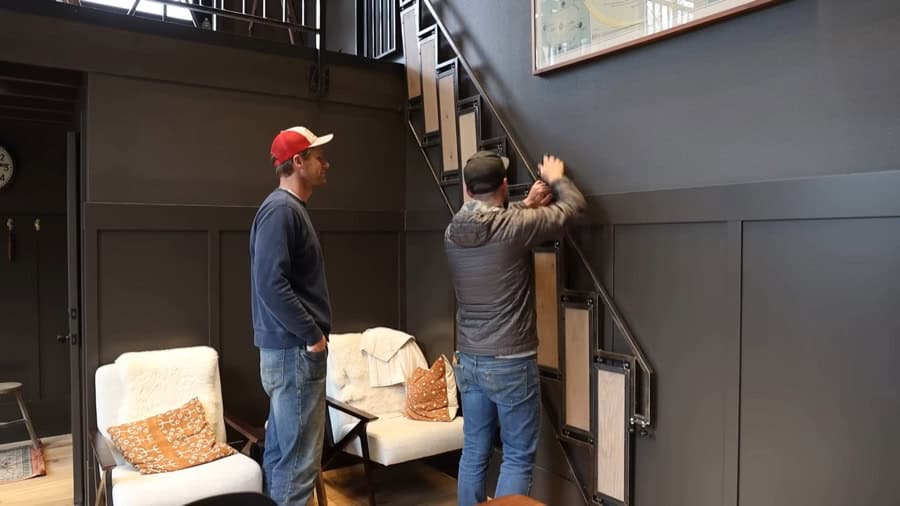 Folding stairs installed in a tiny house for efficient space use and easy access to the upper level.