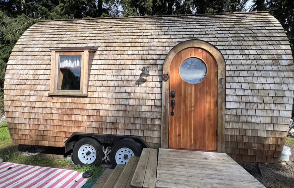 Tiny House with Curved Wooden Exterior