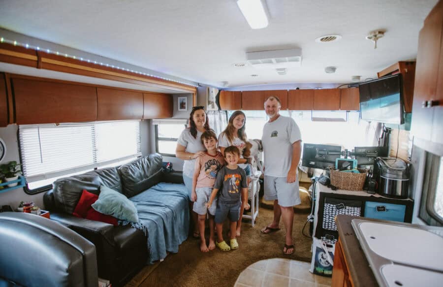 Family enjoying time together inside a cozy RV home.