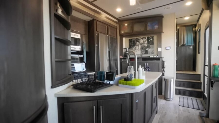 Modern toy hauler kitchen with compact appliances and efficient layout.