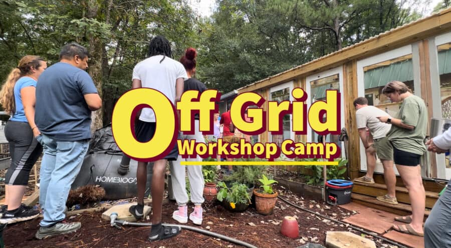 Group attending a tiny house workshop in an outdoor setting.