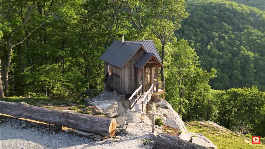 Gravity-Defying Cliff Cabin with Cave-Like Fire Pit 3