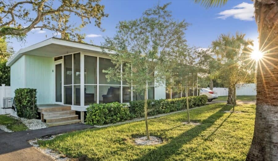Modern tiny house with screened porch in Florida tiny house community.
