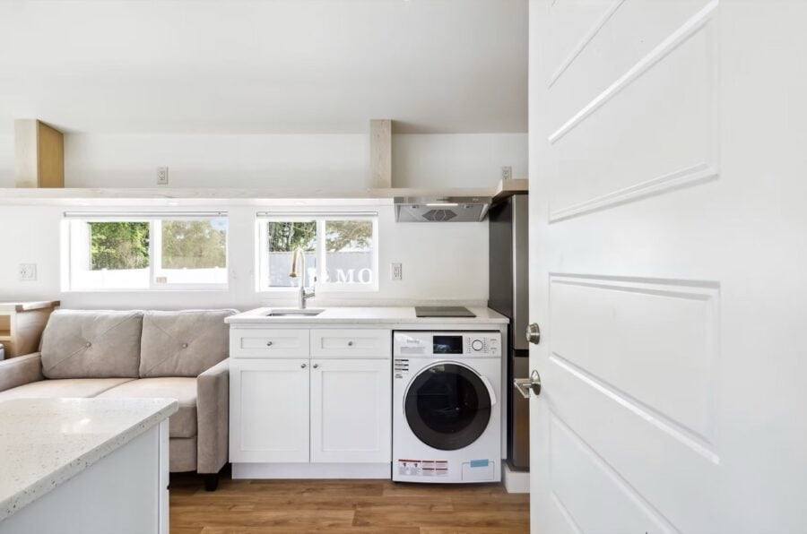 Grove Duplex kitchen featuring stone countertops, induction cooktop, and modern appliances