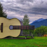 Unique guitar-shaped tiny house with mountain views in Romania.