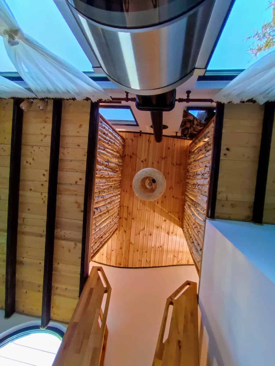 Charming tiny house with a guitar-shaped design and mountaintop views in Romania. Perfect for small.