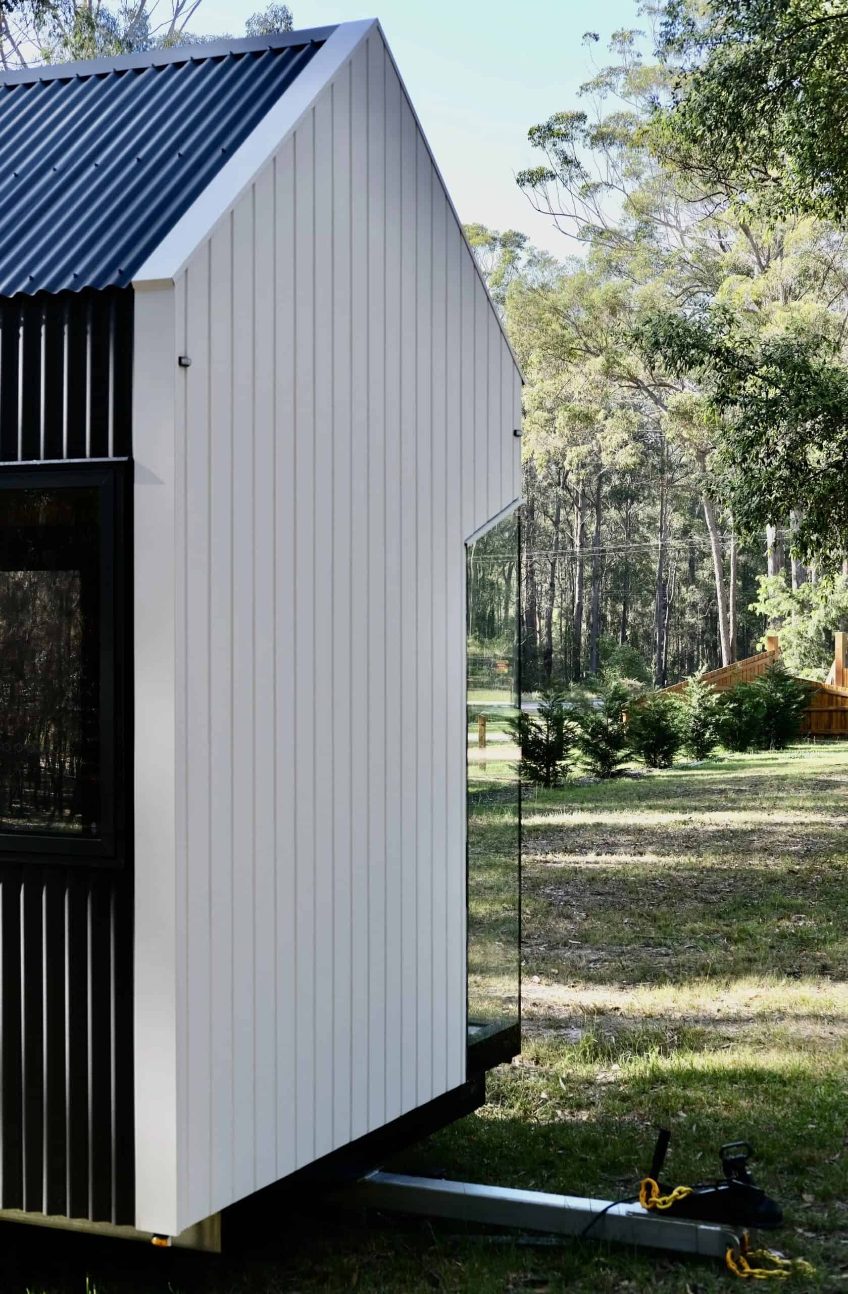 Exterior view of the Eire tiny house in a natural setting