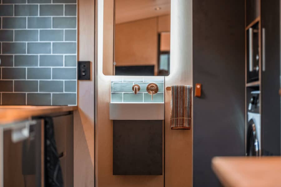 Modern tiny house interior with compact fixtures and stylish design elements.