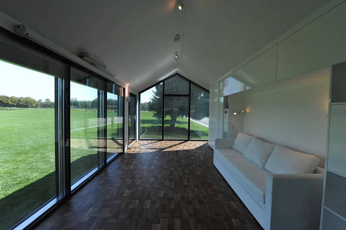 Tiny House Interior with Large Windows and Scenic Views.