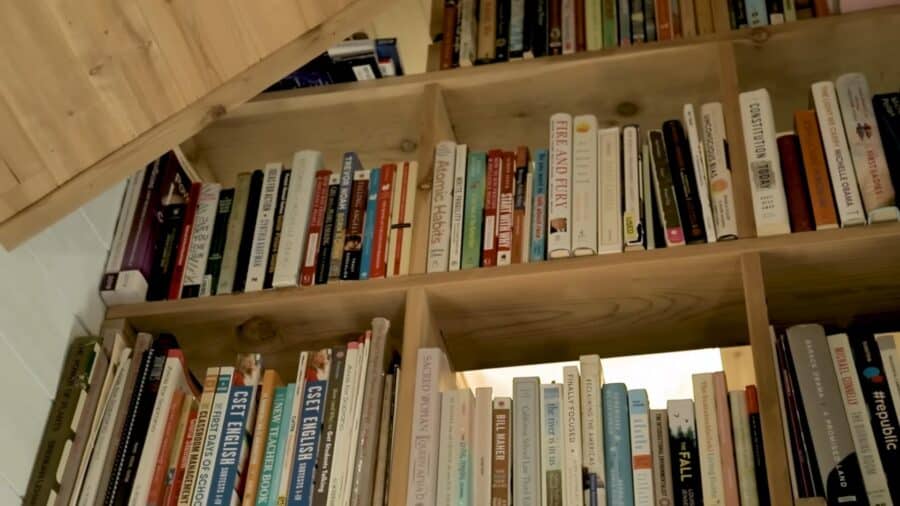 Cozy tiny house interior with wooden shelves and books in Los Angeles.