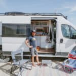 Van life tiny house with built-in toaster oven for small space living.