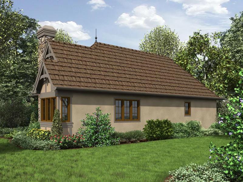 Tiny house with traditional design and lush garden setting.