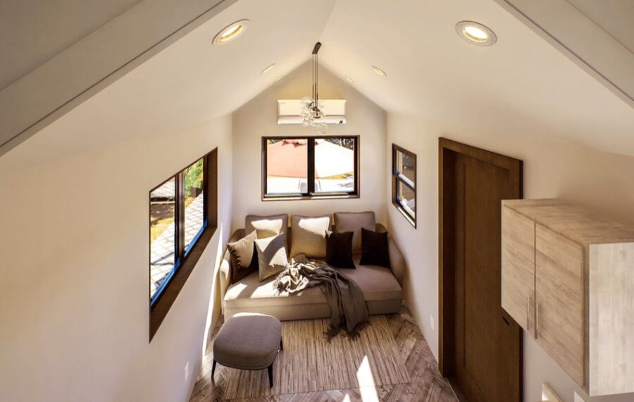 Cozy tiny house interior with French doors and natural light.