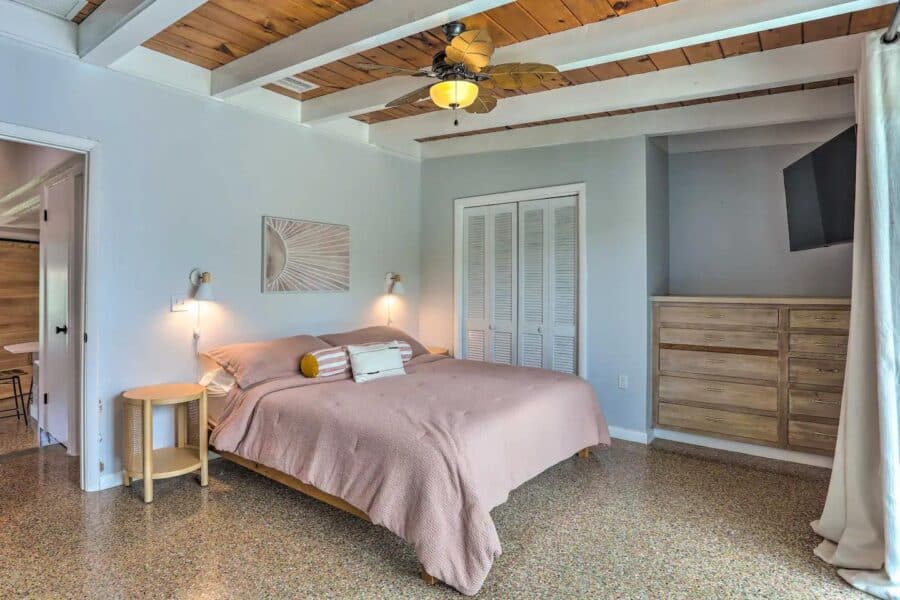 Bright and airy tiny house bedroom with minimalist design and natural light.