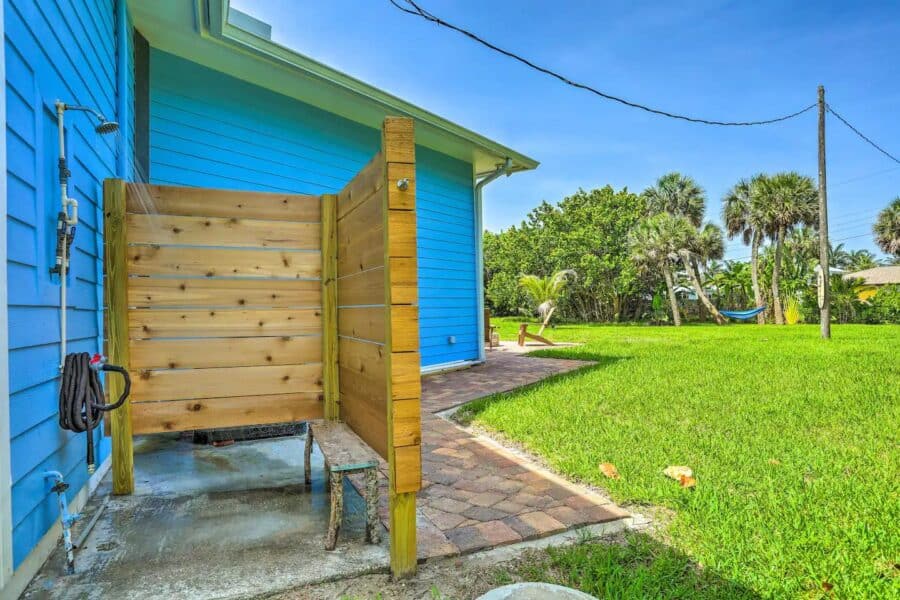 Outdoor shower setup at a coastal tiny house in Fort Pierce, Florida.