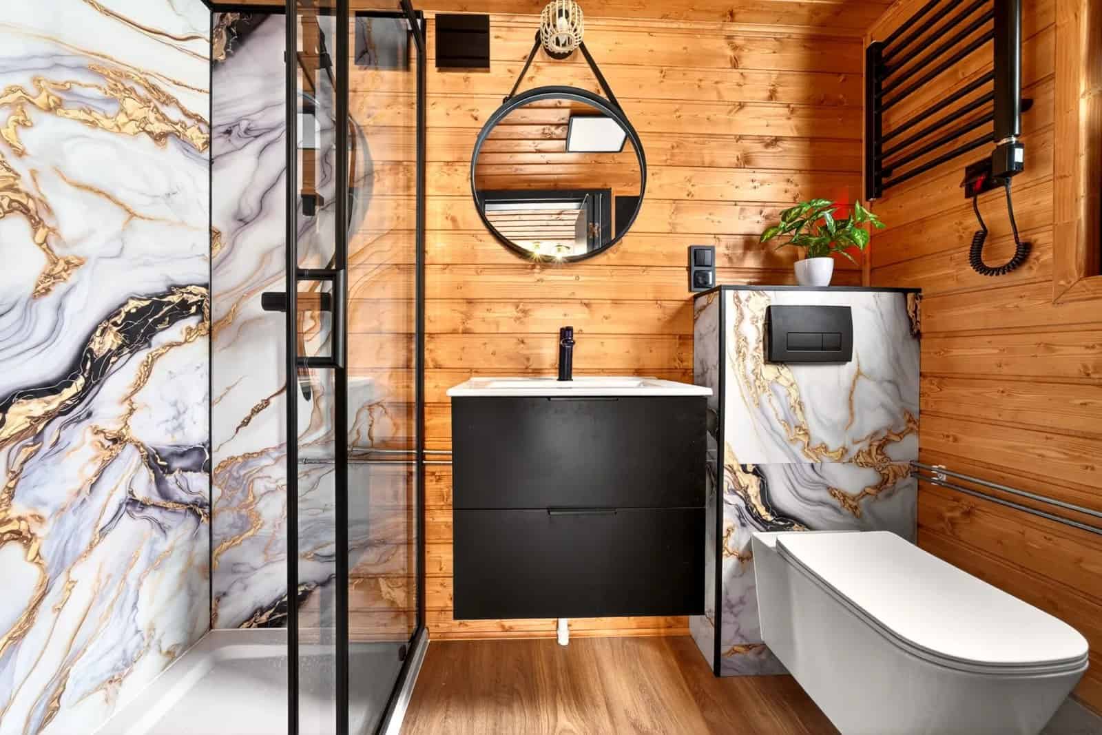 An alternate Katrin bathroom finish with white-and-gold marble and a glass walk-in shower