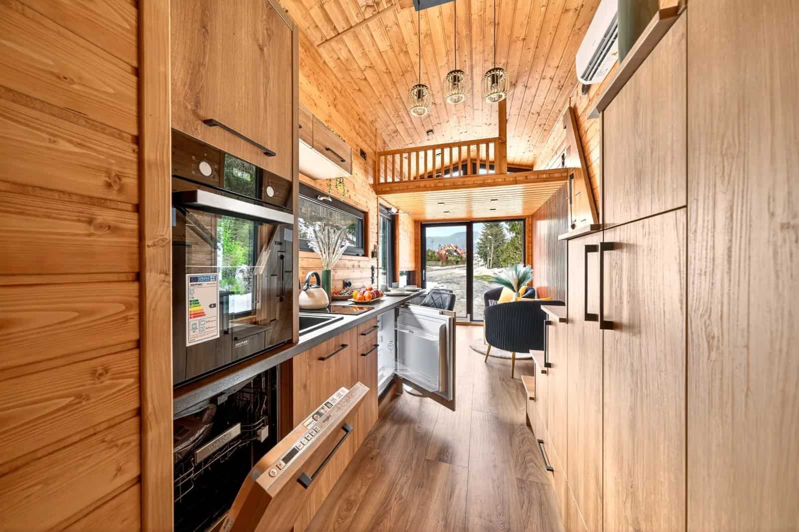 Galley kitchen in the Katrin running beneath the two mezzanine lofts under a gable ceiling