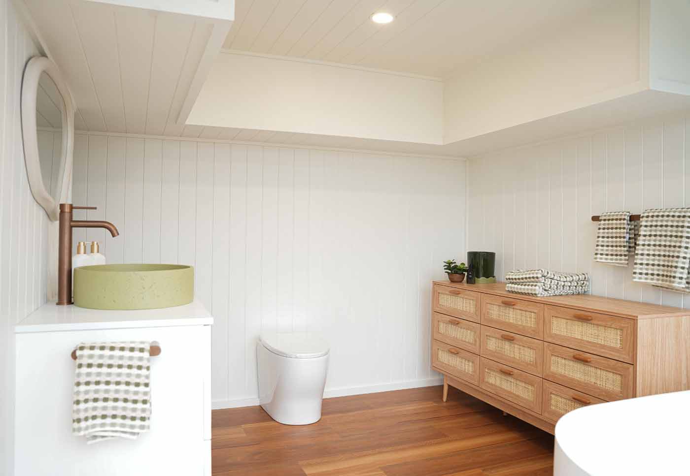 Wide view of the Kookaburra 2.0 bathroom showing the toilet, vanity, and open floor space