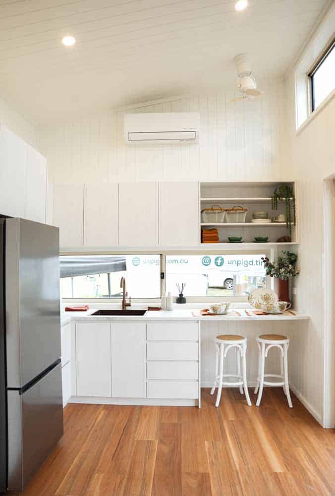 Kitchen breakfast bar in the Kookaburra 2.0 with two stools under a long window