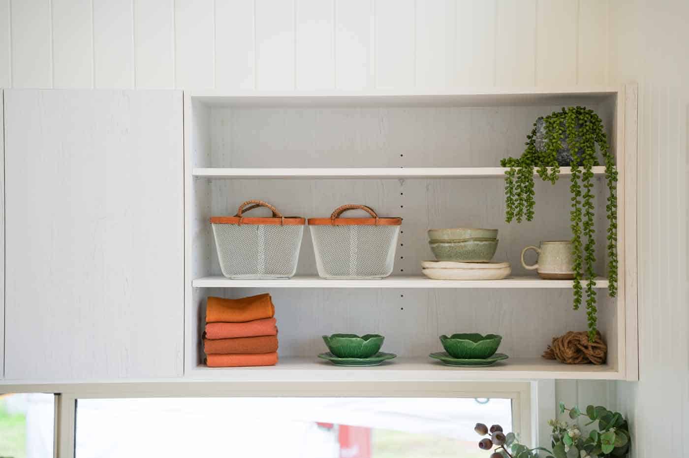 Open kitchen shelving above the window in the Kookaburra 2.0