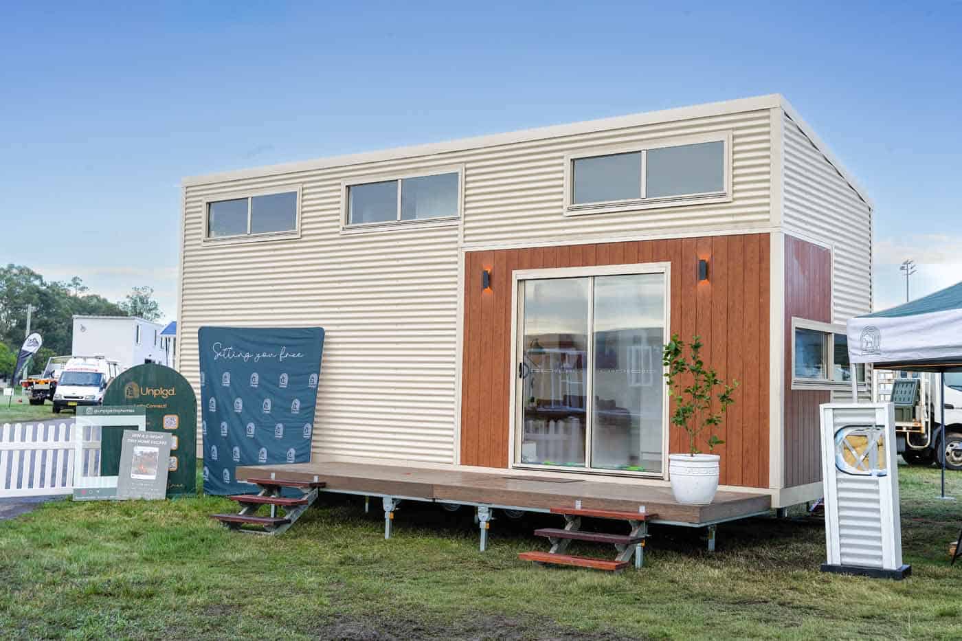 Angled exterior view of the Kookaburra 2.0 showing the full-length composite deck and sliding glass door