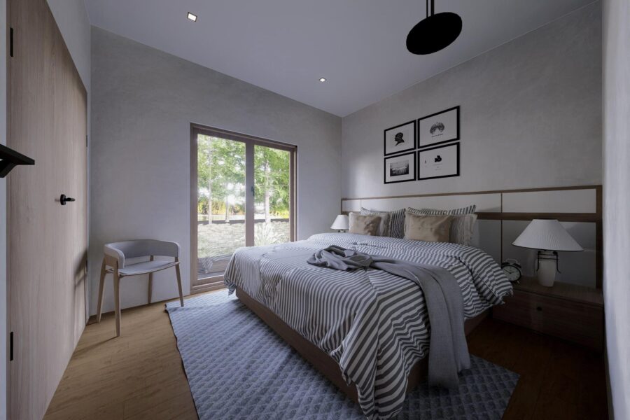 Cozy small bedroom with minimalist decor and large window for natural light.