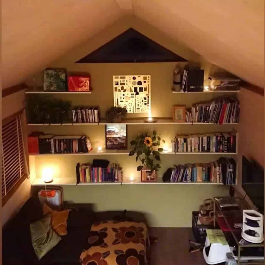 Cozy tiny house interior with built-in bookshelves and warm lighting.