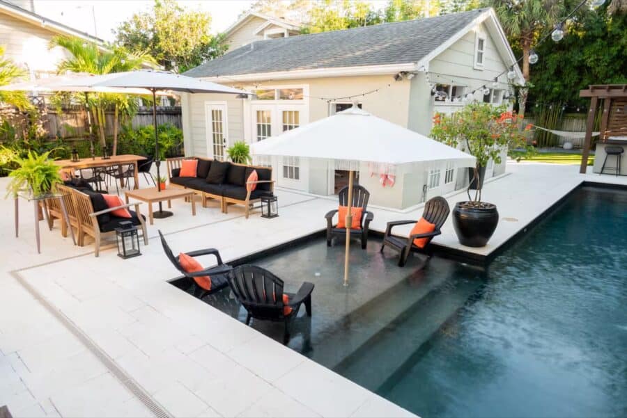 Small Florida tiny house with outdoor pool and patio area for relaxation.