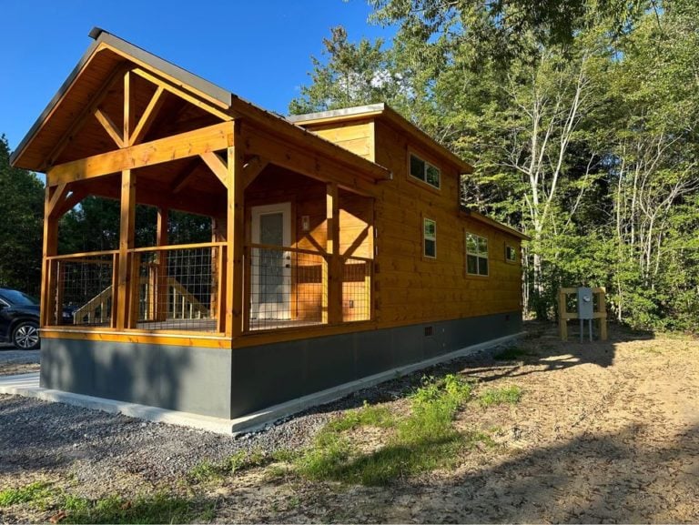 A tiny home by Green River Cabins & Cottages