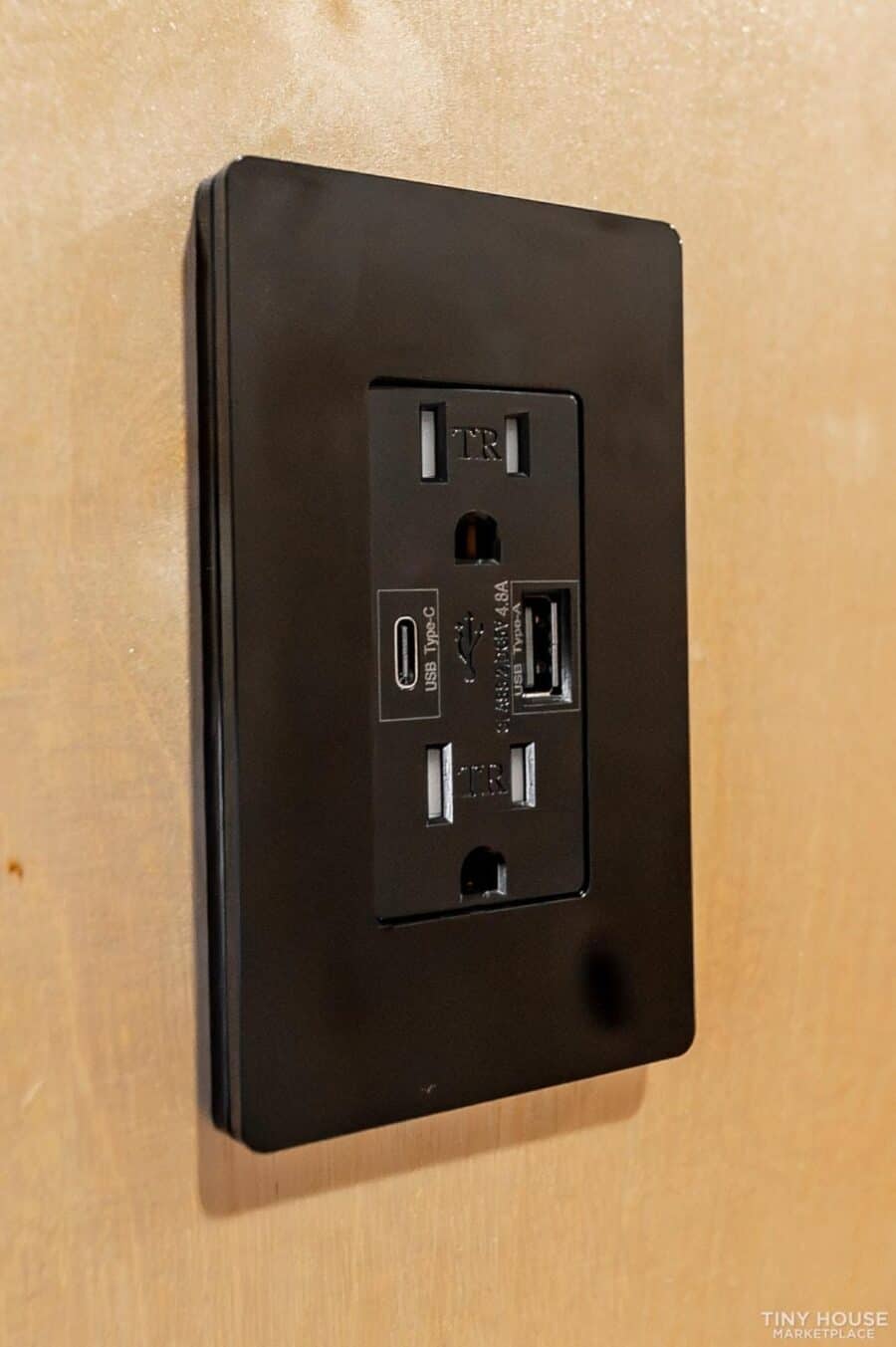 Power outlet with USB ports in a tiny house.