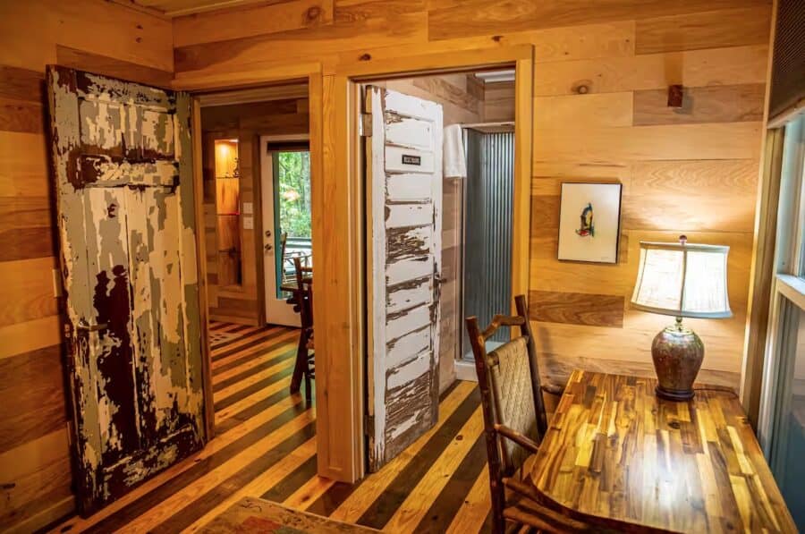 Charming wooden cabin interior with rustic decor and natural wood finishes in Mentone, Alabama.