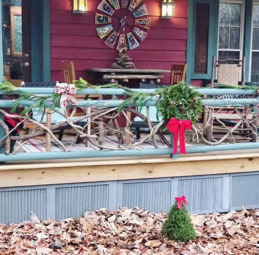 Festive decorated cabin porch with wreaths and ribbons in Mentone, Alabama.