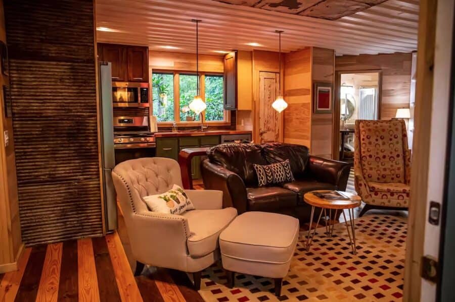 Charming cabin interior with warm wood accents and comfortable seating in Mentone, Alabama.