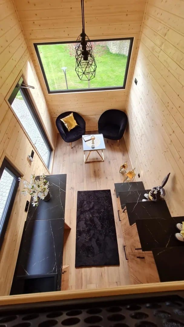 Looking down from the loft over the Mini's living area and kitchen