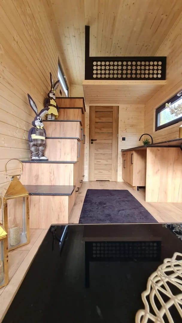 Storage staircase to the loft beside the kitchen in the Mini tiny house