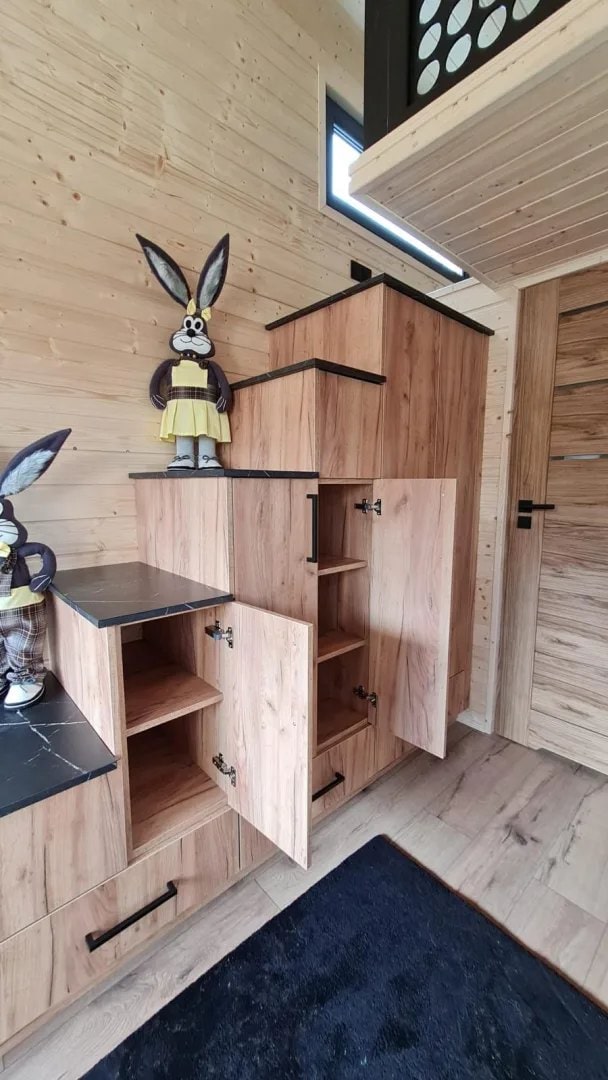 Storage staircase in the Mini with cabinets and drawers built into each step