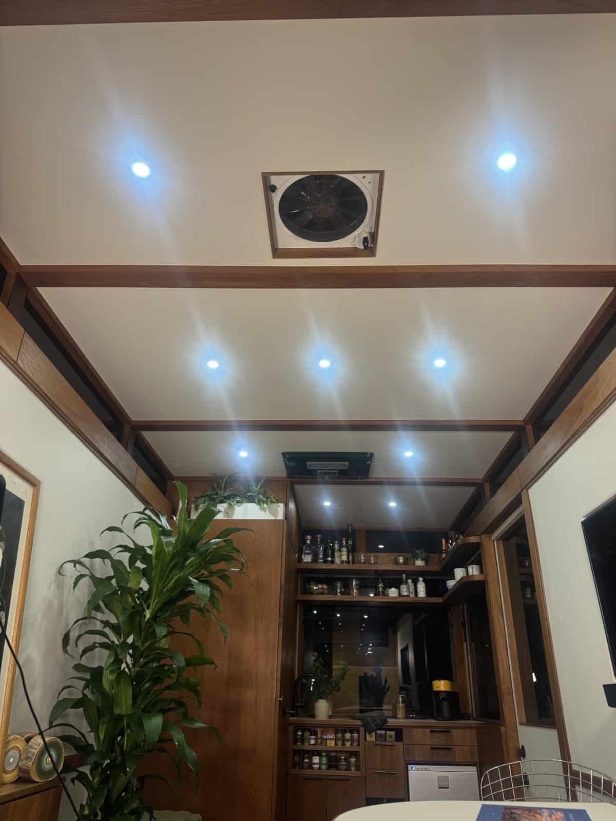 Ceiling of the MoD tiny house with teak beams, recessed LEDs and a Fan-Tastic roof vent