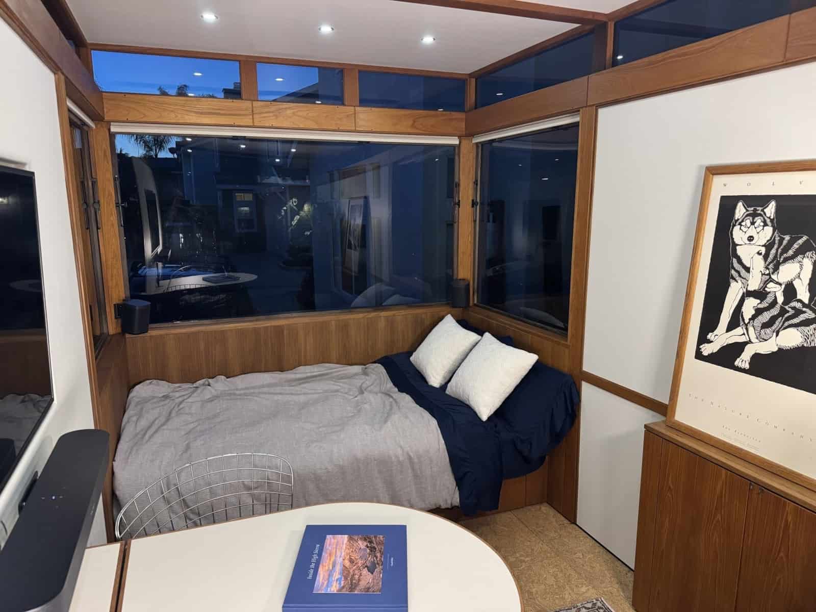The MoD daybed made up as a bed at night with clerestory windows above