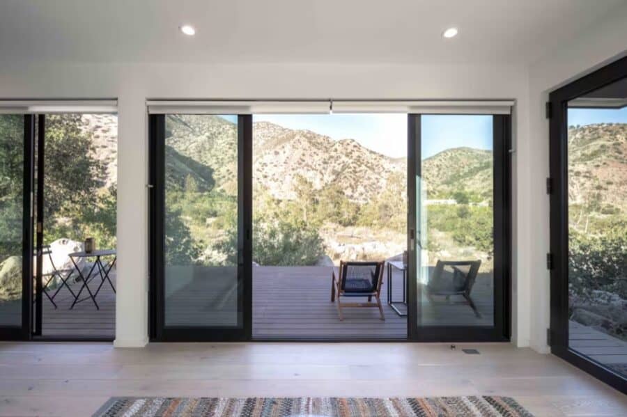 Bright interior with large sliding glass doors overlooking canyon scenery.