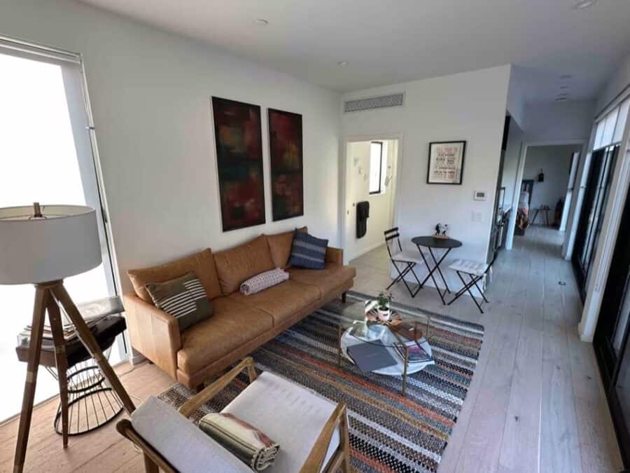 Cozy living room in a modern canyon cabin with minimalist decor and natural light.